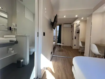 Un ou plusieurs lits dans un hébergement de l'établissement Hotel Nation Montmartre