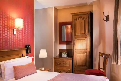 Un ou plusieurs lits dans un hébergement de l'établissement Welcome Hotel