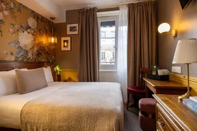 Un ou plusieurs lits dans un hébergement de l'établissement Welcome Hotel