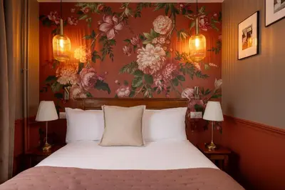 Un ou plusieurs lits dans un hébergement de l'établissement Welcome Hotel