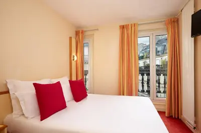Un ou plusieurs lits dans un hébergement de l'établissement Hotel Antin St Georges