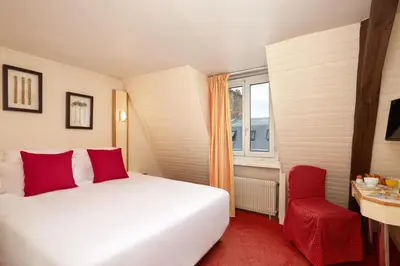 Un ou plusieurs lits dans un hébergement de l'établissement Hotel Antin St Georges