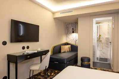 Un ou plusieurs lits dans un hébergement de l'établissement Hôtel Mondial
