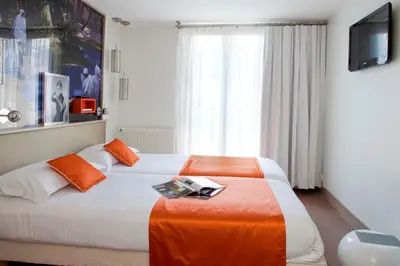 Un ou plusieurs lits dans un hébergement de l'établissement Hôtel Mayet