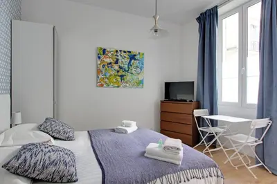 Un ou plusieurs lits dans un hébergement de l'établissement Pick a Flat's Apartment in Montmartre - Rue des Martyrs studio