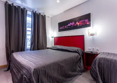 Un ou plusieurs lits dans un hébergement de l'établissement Victory Hotel Galou