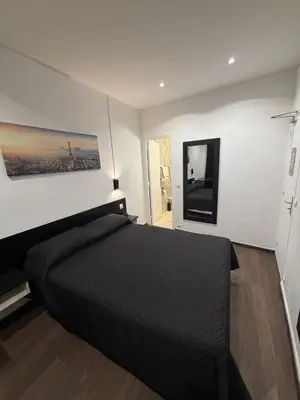 Un ou plusieurs lits dans un hébergement de l'établissement Victory Hotel Galou
