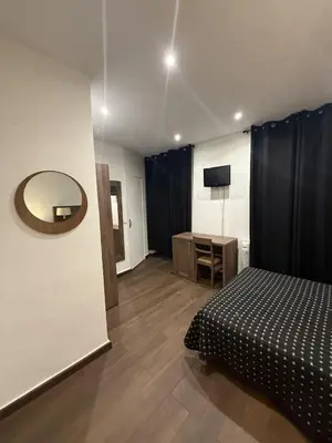 Un ou plusieurs lits dans un hébergement de l'établissement Victory Hotel Galou