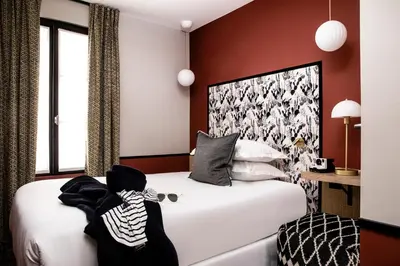 Un ou plusieurs lits dans un hébergement de l'établissement Hotel Paris Lafayette