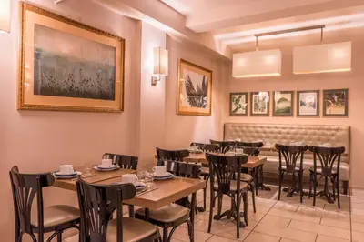 Restaurant ou autre lieu de restauration dans l'établissement Paris France Hotel