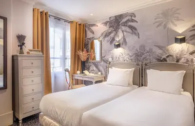 Un ou plusieurs lits dans un hébergement de l'établissement Hotel London