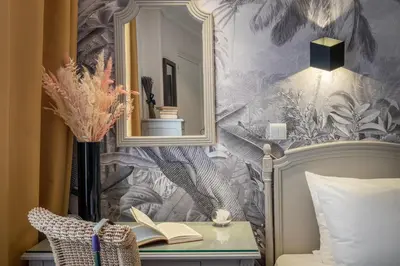 Un ou plusieurs lits dans un hébergement de l'établissement Hotel London