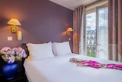 Un ou plusieurs lits dans un hébergement de l'établissement Hotel London