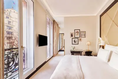 Un ou plusieurs lits dans un hébergement de l'établissement Hôtel Fouquet's Paris