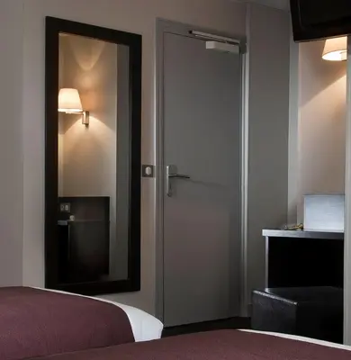 Un ou plusieurs lits dans un hébergement de l'établissement Hôtel des Ecrivains