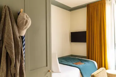 Télévision ou salle de divertissement dans l'établissement Hôtel Casimir