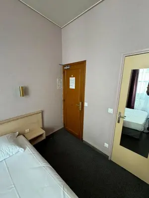 Un ou plusieurs lits dans un hébergement de l'établissement Hôtel Flor Rivoli