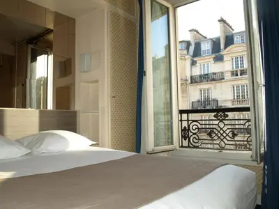 Un ou plusieurs lits dans un hébergement de l'établissement Hôtel Eiffel Kensington