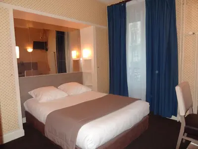 Un ou plusieurs lits dans un hébergement de l'établissement Hôtel Eiffel Kensington
