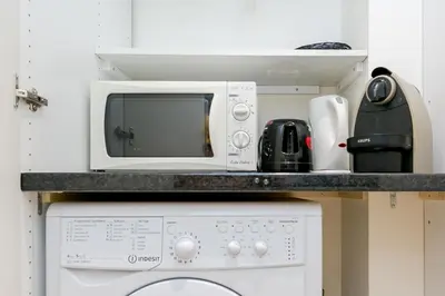 Cuisine ou kitchenette dans l'établissement Sourdiere Louvre Vendome with AC