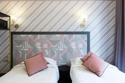 Un ou plusieurs lits dans un hébergement de l'établissement Hôtel Gérando