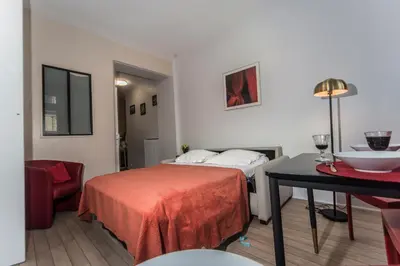 Un ou plusieurs lits dans un hébergement de l'établissement Saint Michel Quartier Latin With AC