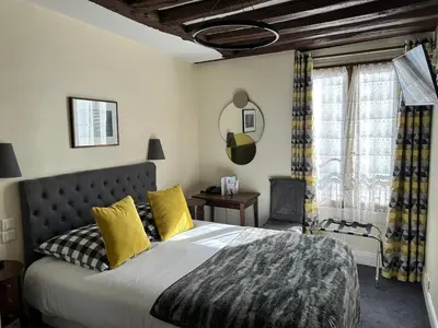 Un ou plusieurs lits dans un hébergement de l'établissement Hotel du Dragon