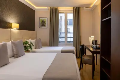 Un ou plusieurs lits dans un hébergement de l'établissement Nord Est Hotel