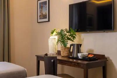Un ou plusieurs lits dans un hébergement de l'établissement Nord Est Hotel