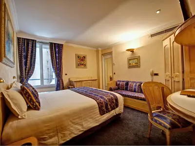 Un ou plusieurs lits dans un hébergement de l'établissement Hôtel Du Midi Paris Montparnasse