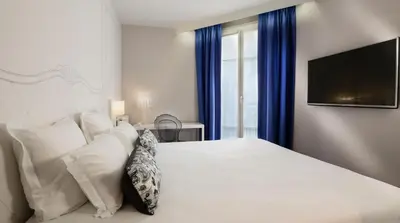 Un ou plusieurs lits dans un hébergement de l'établissement Hôtel Paris Vaugirard