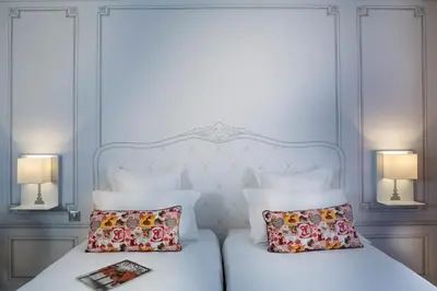 Un ou plusieurs lits dans un hébergement de l'établissement Hôtel Paris Vaugirard