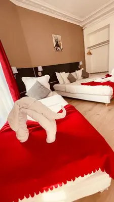 Un ou plusieurs lits dans un hébergement de l'établissement Jeff Hotel