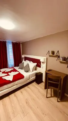 Un ou plusieurs lits dans un hébergement de l'établissement Jeff Hotel