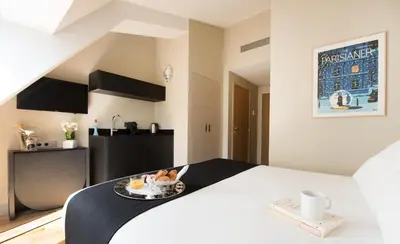 Un ou plusieurs lits dans un hébergement de l'établissement Hôtel Helzear Etoile by Esteem