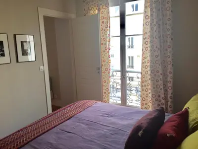 Un ou plusieurs lits dans un hébergement de l'établissement Appartement Saint-Dominique 7 eme