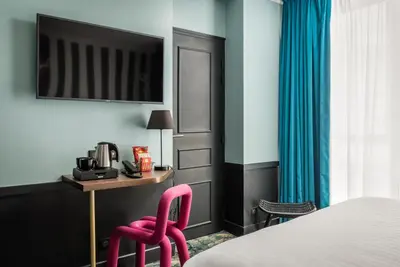 Un ou plusieurs lits dans un hébergement de l'établissement Hotel Archetype Etoile