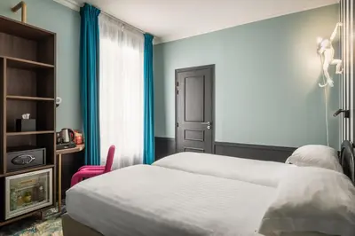 Un ou plusieurs lits dans un hébergement de l'établissement Hotel Archetype Etoile