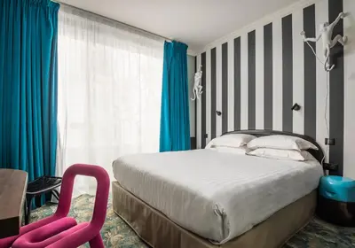 Un ou plusieurs lits dans un hébergement de l'établissement Hotel Archetype Etoile
