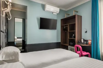 Un ou plusieurs lits dans un hébergement de l'établissement Hotel Archetype Etoile