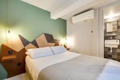 Un ou plusieurs lits dans un hébergement de l'établissement WIT Hotel