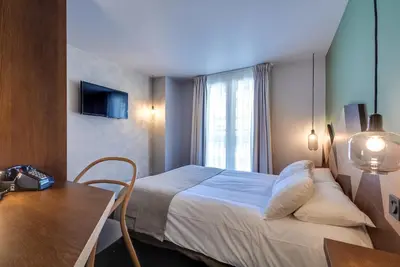 Un ou plusieurs lits dans un hébergement de l'établissement WIT Hotel