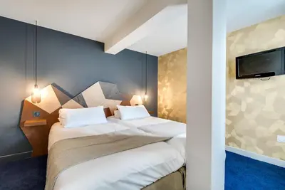Un ou plusieurs lits dans un hébergement de l'établissement WIT Hotel