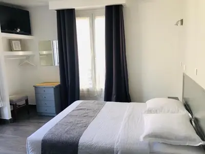 Un ou plusieurs lits dans un hébergement de l'établissement Hôtel Clauzel Paris