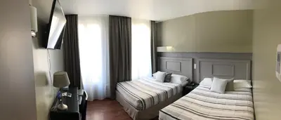 Un ou plusieurs lits dans un hébergement de l'établissement Cosmotel Hotel