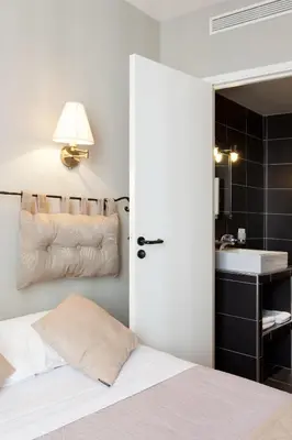 Un ou plusieurs lits dans un hébergement de l'établissement Cosmotel Hotel