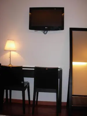 Télévision ou salle de divertissement dans l'établissement Cosmotel Hotel