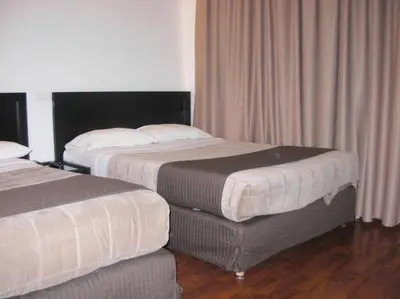 Un ou plusieurs lits dans un hébergement de l'établissement Cosmotel Hotel