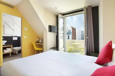 Un ou plusieurs lits dans un hébergement de l'établissement Hotel Auguste