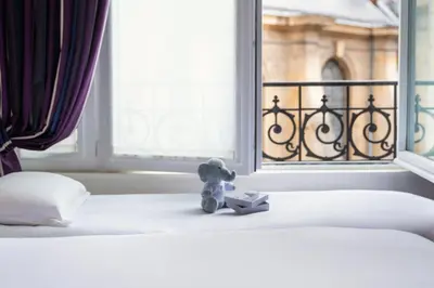 Un ou plusieurs lits dans un hébergement de l'établissement Hôtel Pont Royal Paris
